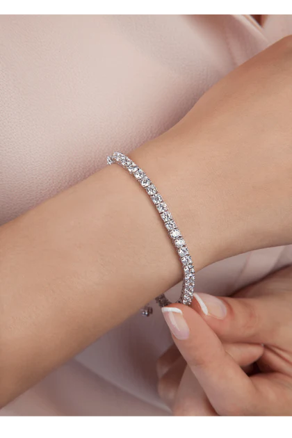 Huether Family Match Pointe - Why is it called a tennis bracelet? The term Tennis  Bracelet was coined thanks to Chris Evert, a professional tennis player  from the USA. During a ferocious